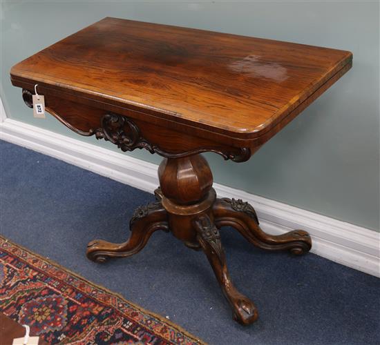 An early Victorian rosewood folding card table W.92cm